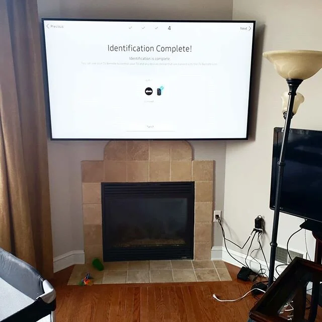 75&quot; Samsung over a fireplace. This one fought me a bit, especially fishing the cables through the chase, but I wrestled it down and got it done.  These customers were great and my man's a boxing fan so you know we were talking shop. 
#tv #instag