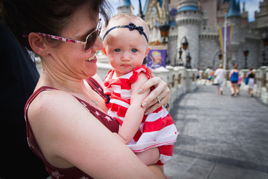 baby's first disney trip / cinderella castle / magic kingdom baby photographer