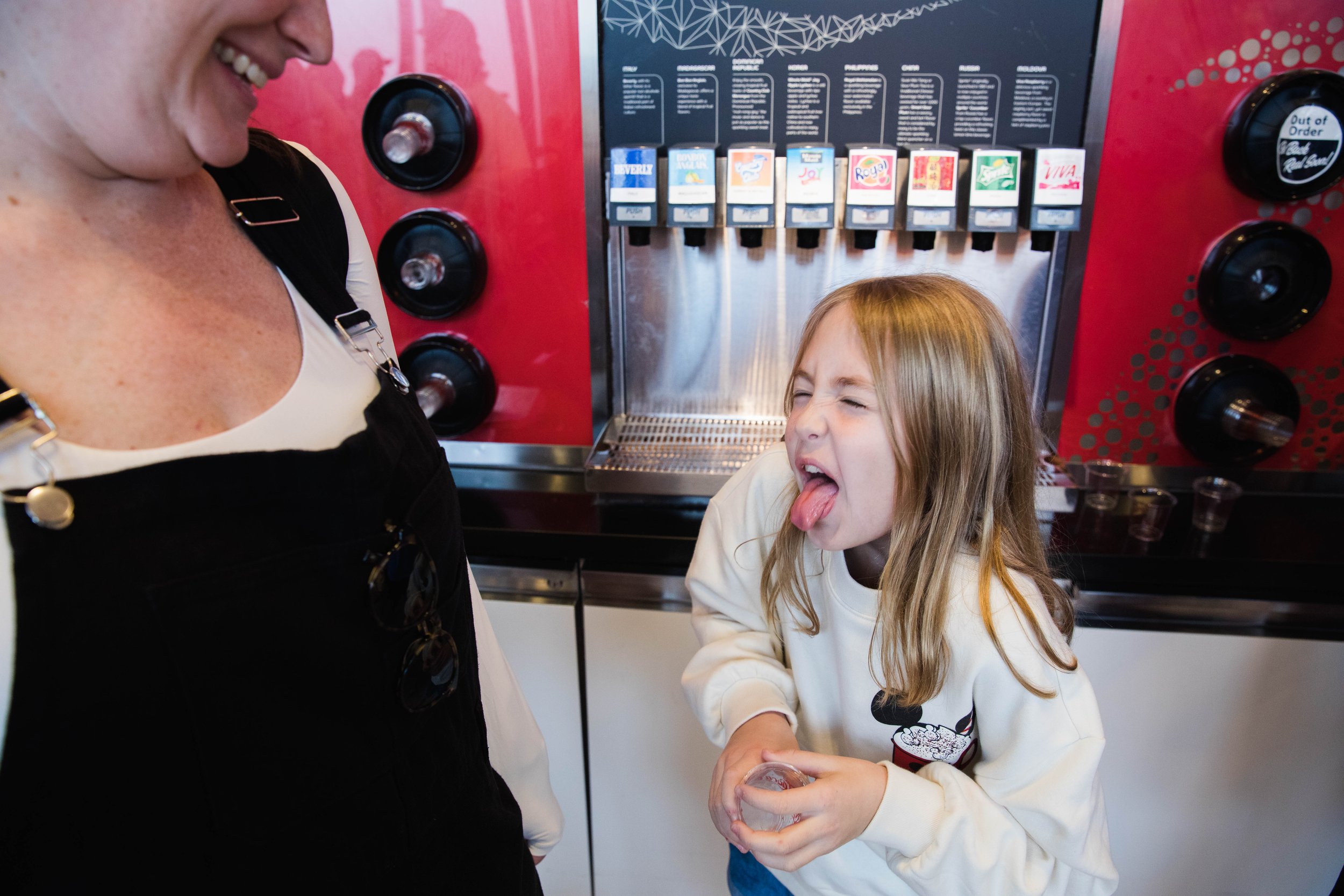 Kid makes disgusted face after trying Beverly drink in Epcot