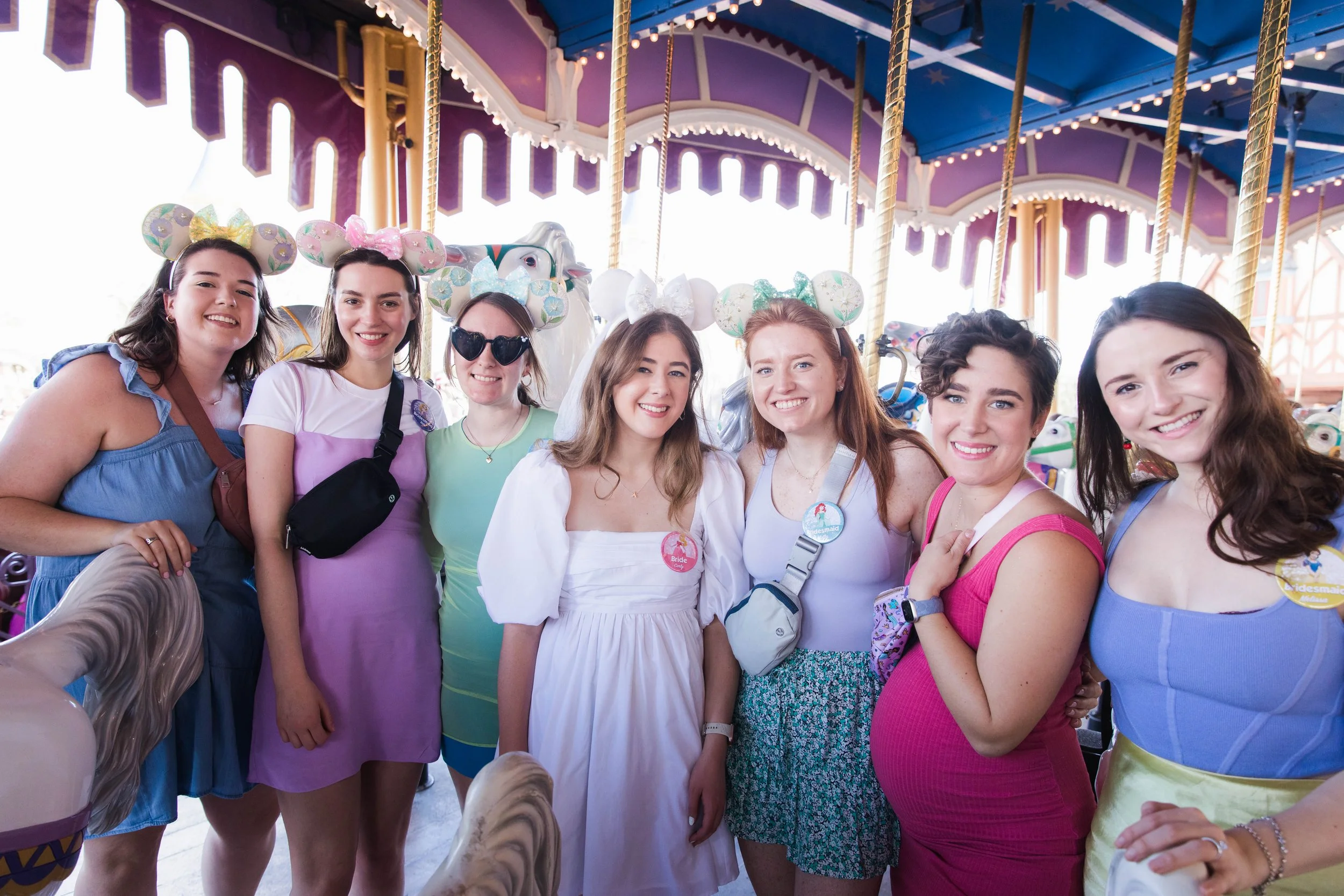 Bachelorette Party poses at Prince Charming Regal Carrousel at Magic Kingdom.