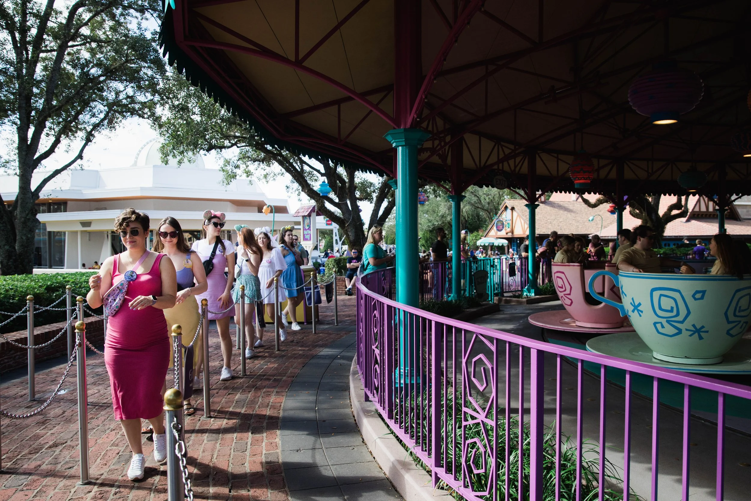Bachelorette Party walks through Fantasyland queue at Magic Kingdom.