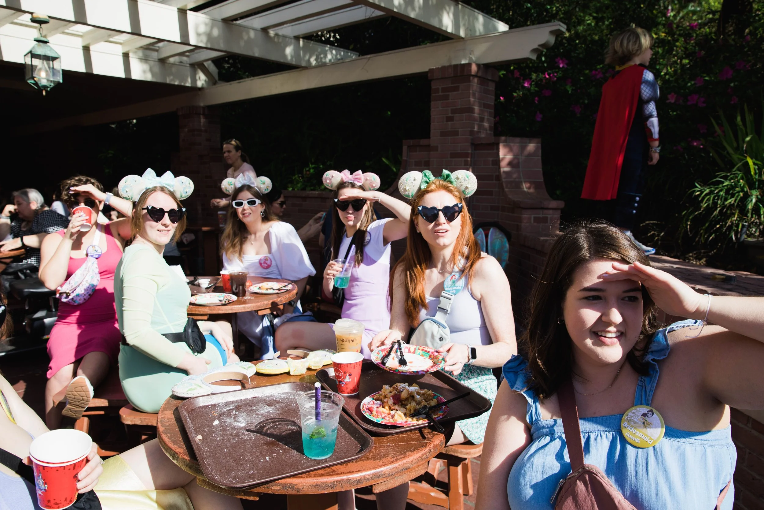 Young women look for princesses at Magic Kingdom.