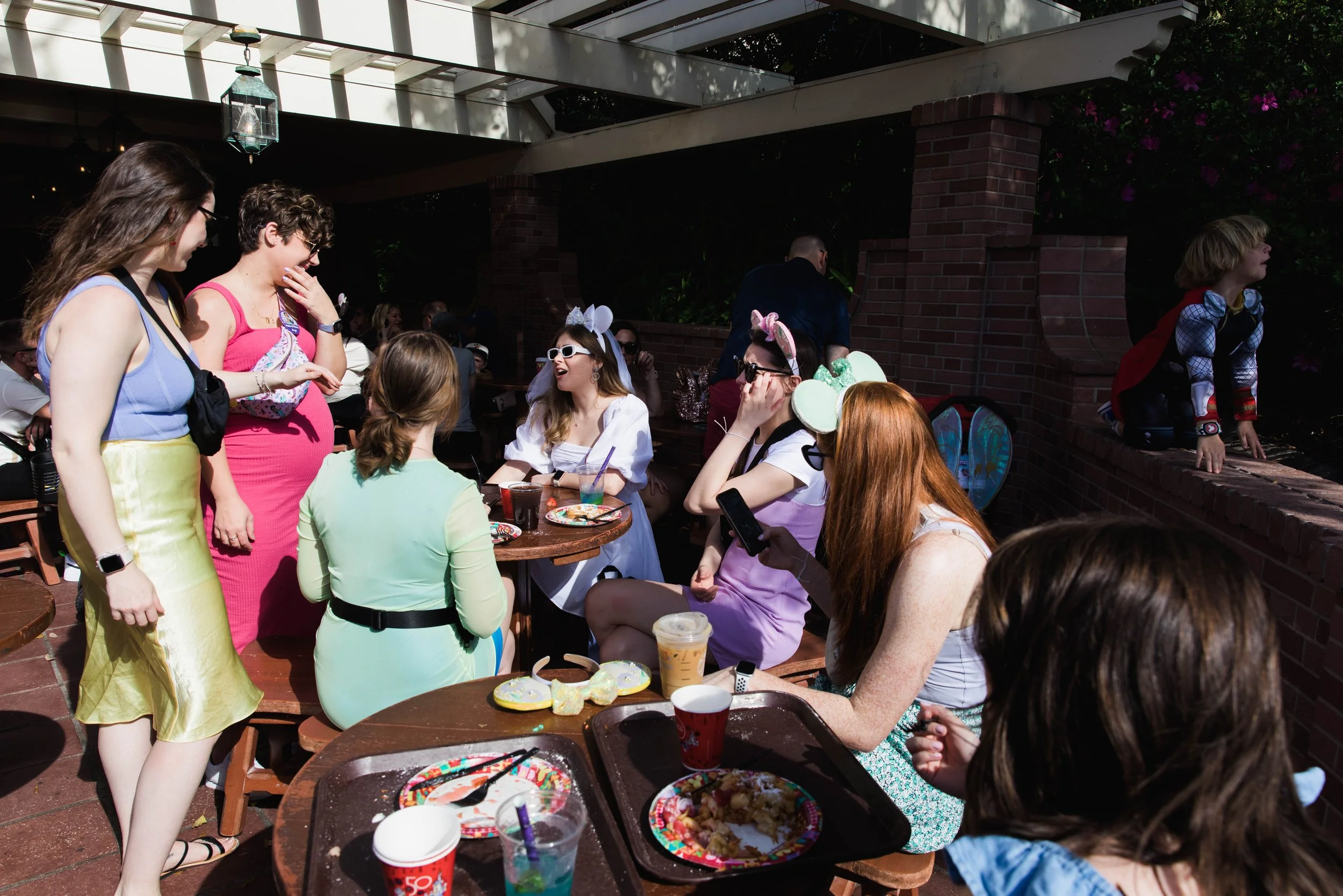 Young women discuss what to do next at the magic Kingdom.