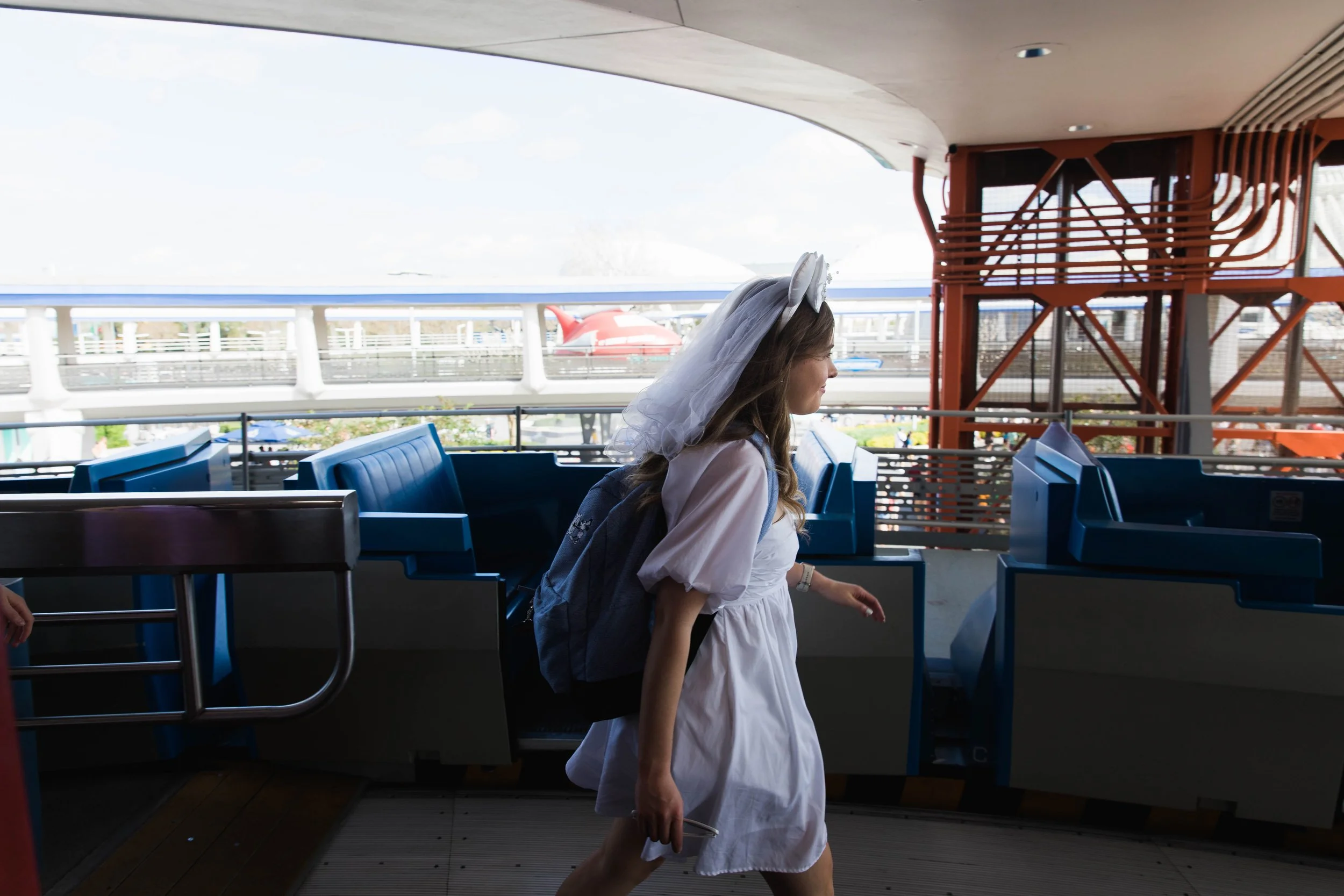 Bride to be boards Peoplemover attraction at Magic Kingdom.