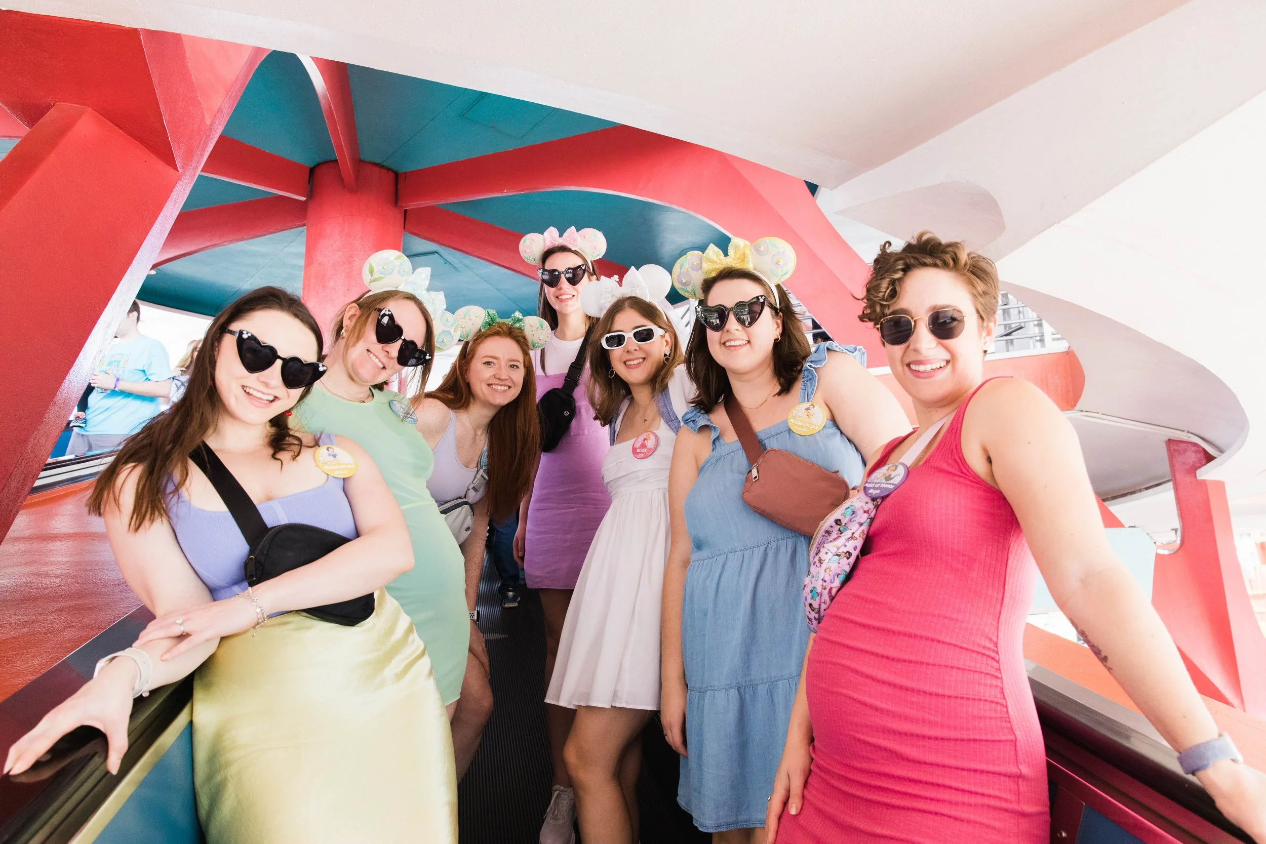 Bachelorette party poses on ramp to Tomorrowland Transit Authority.