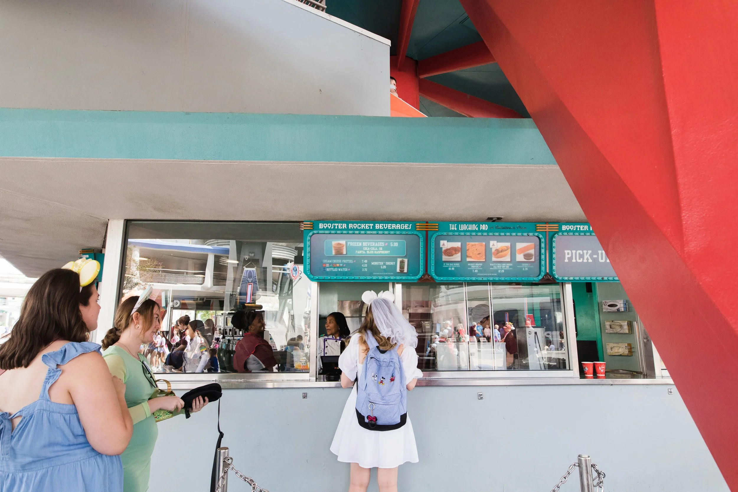 Bride orders Mickey pretzels at the Lunching Pad in Tomorrowland.