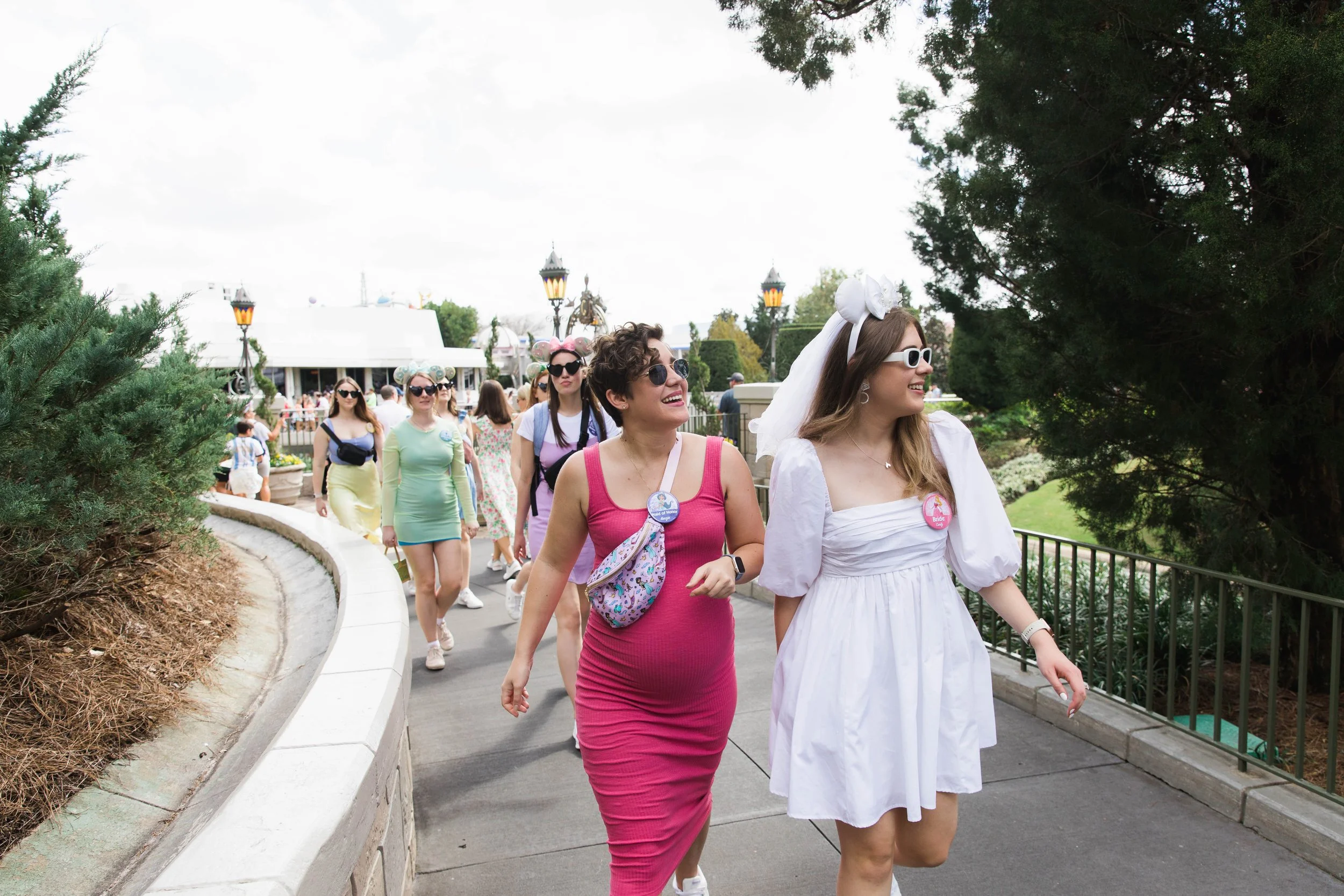 Bride to be and sister walk past Cinderella Castle in Magic Kingdom.