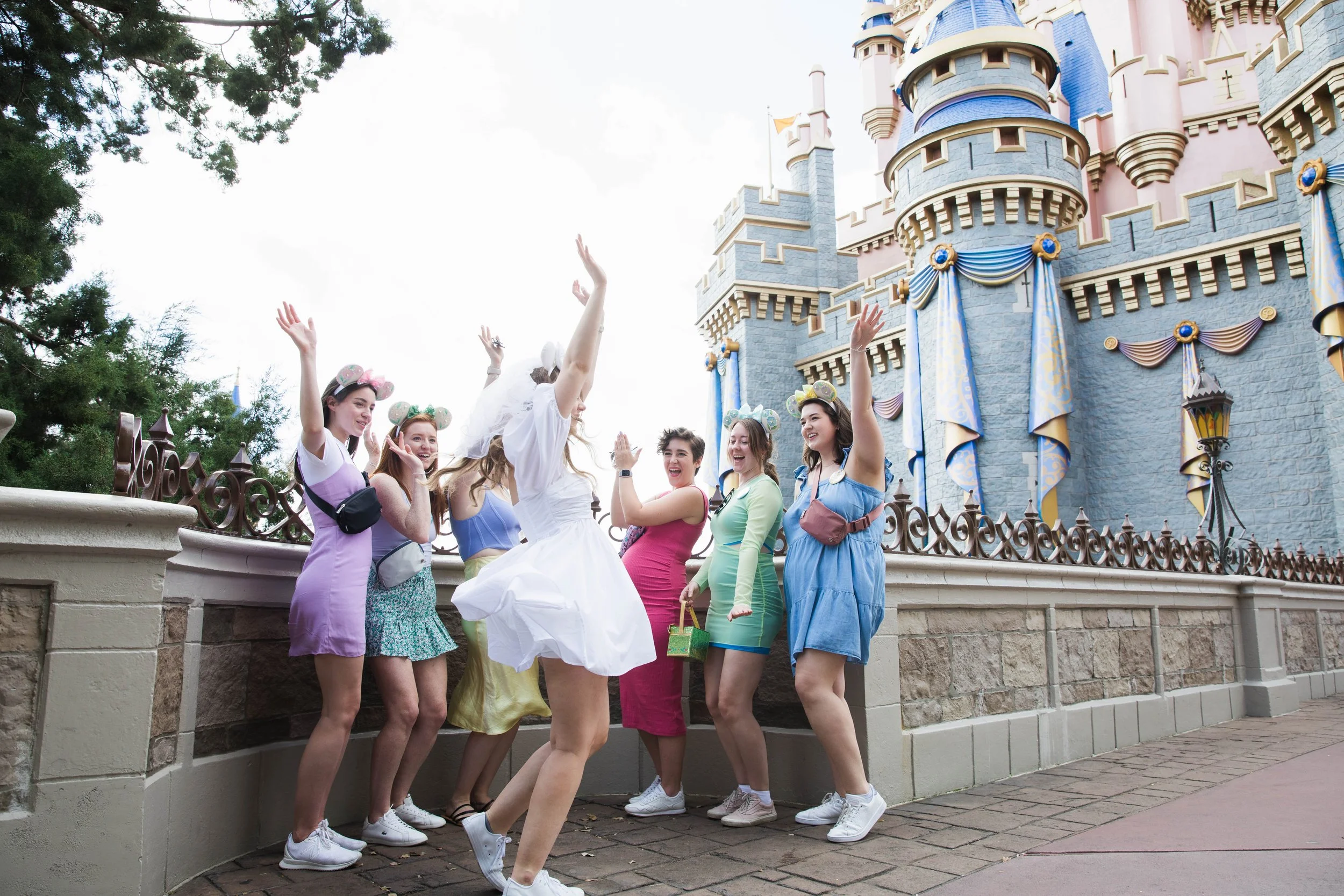 Bride twirls in front of Cinderella Castle.