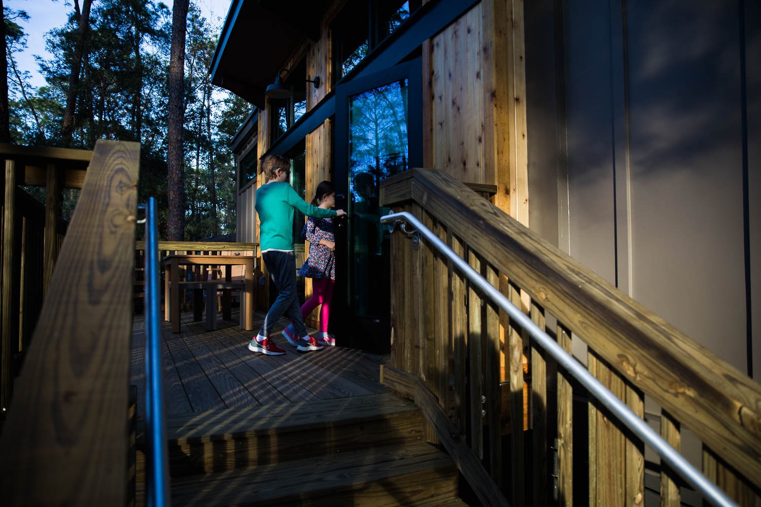 Kids enter their Disney Vacation Club cabin at Fort Wilderness Resort.
