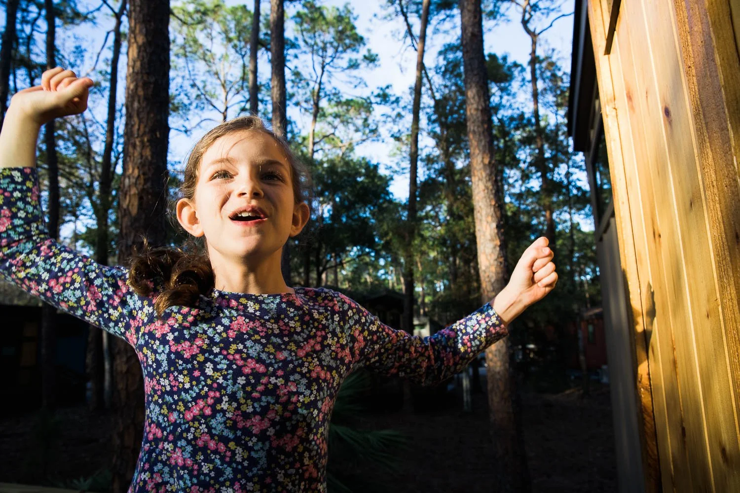 Girl jumps with excitement for the DVC cabins at Fort Wilderness in Walt Disney World.