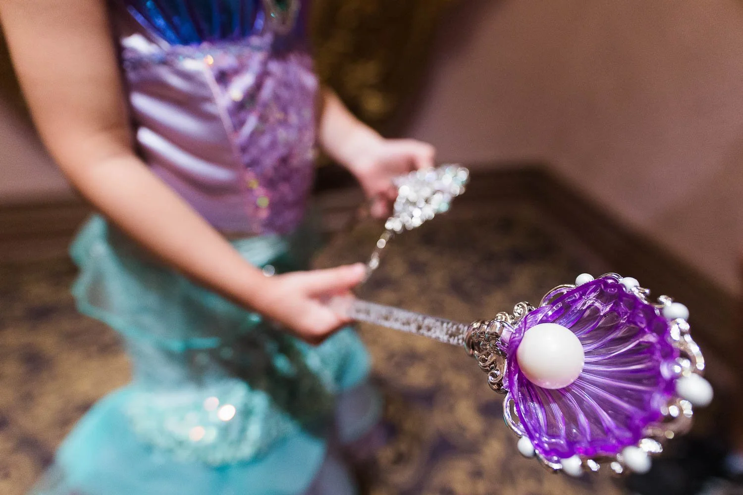 Up close details of Princess Ariel dress and wand at Magic Kingdom.