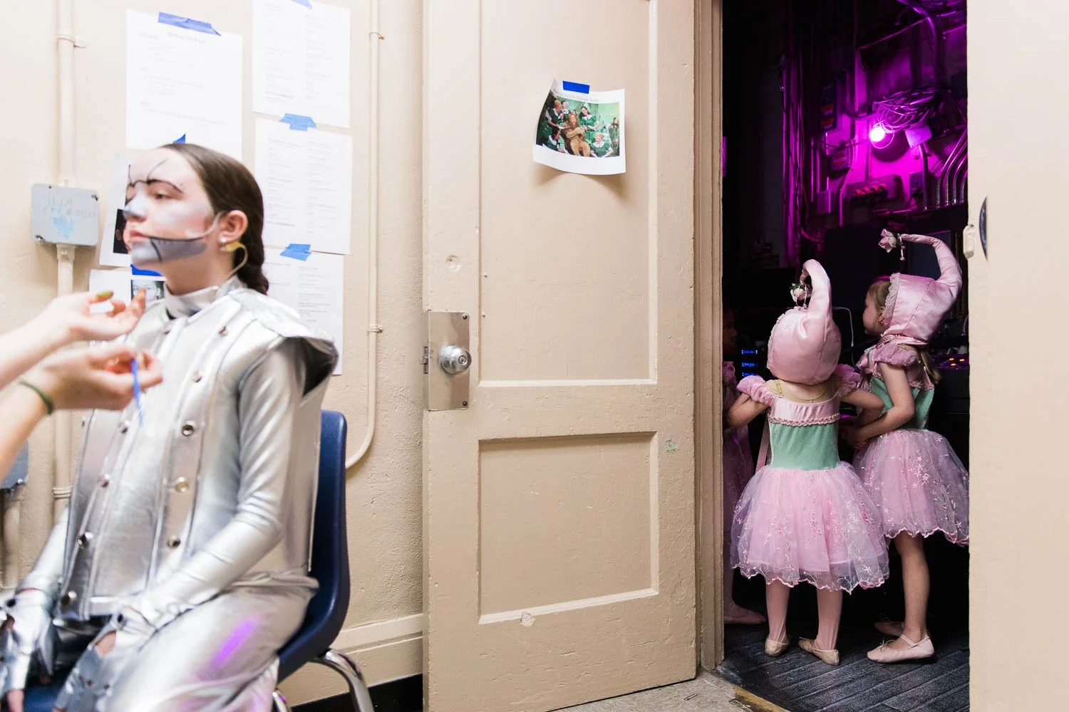 Tin man gets face paint behind the scenes of the Wizard of Oz youth edition.