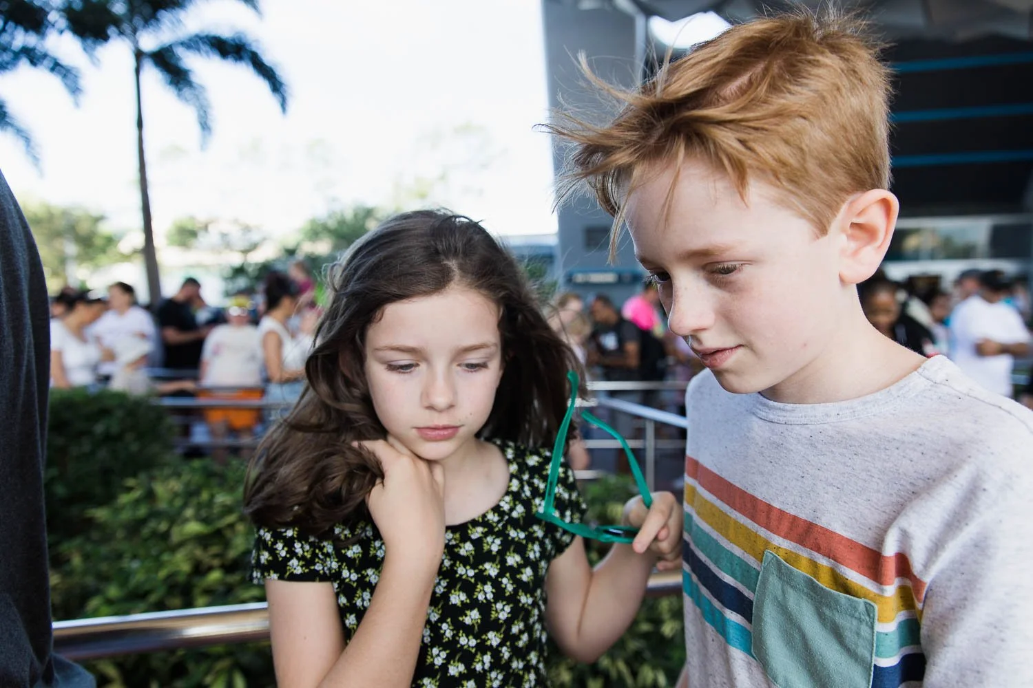 Kids queue up to wait for Spaceship Earth attraction at Epcot.