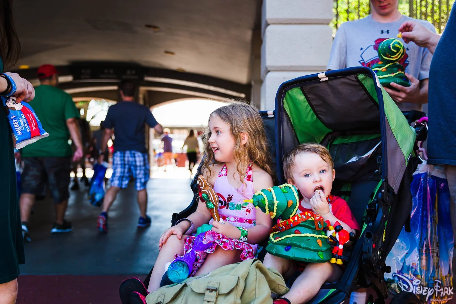 Kids eat popcorn on Main Street USA.