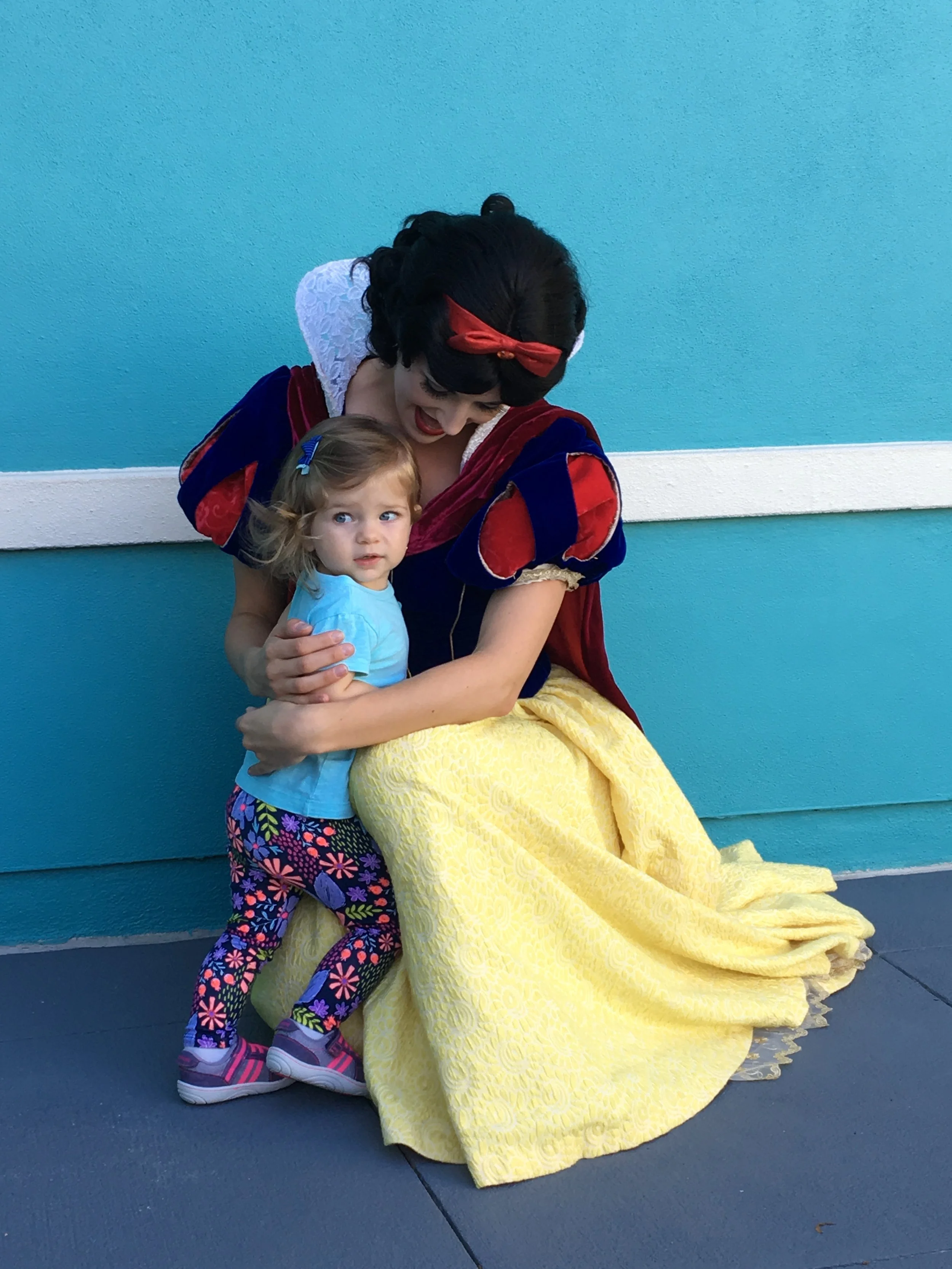 Toddler gets a hug from Snow White at Disney's Hollywood Studios.