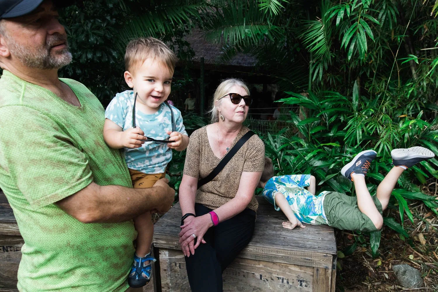 Family takes a rest break on the Gorilla Falls trail at the Animal Kingdom.
