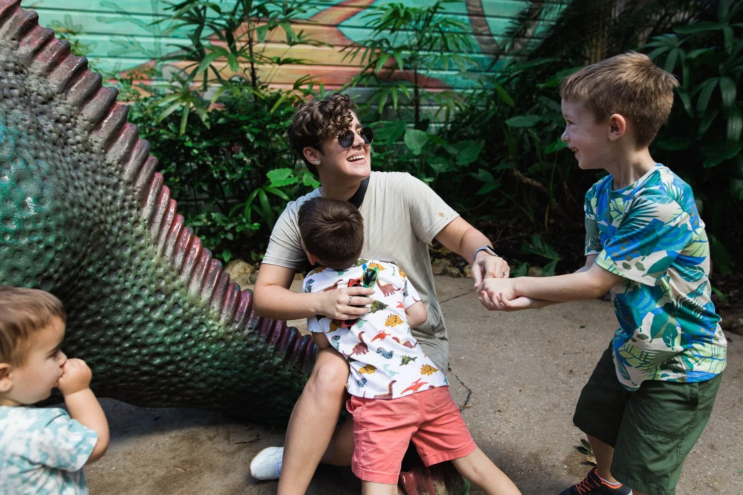 Mom plays with kids near Dinoland, USA in the Animal Kingdom.