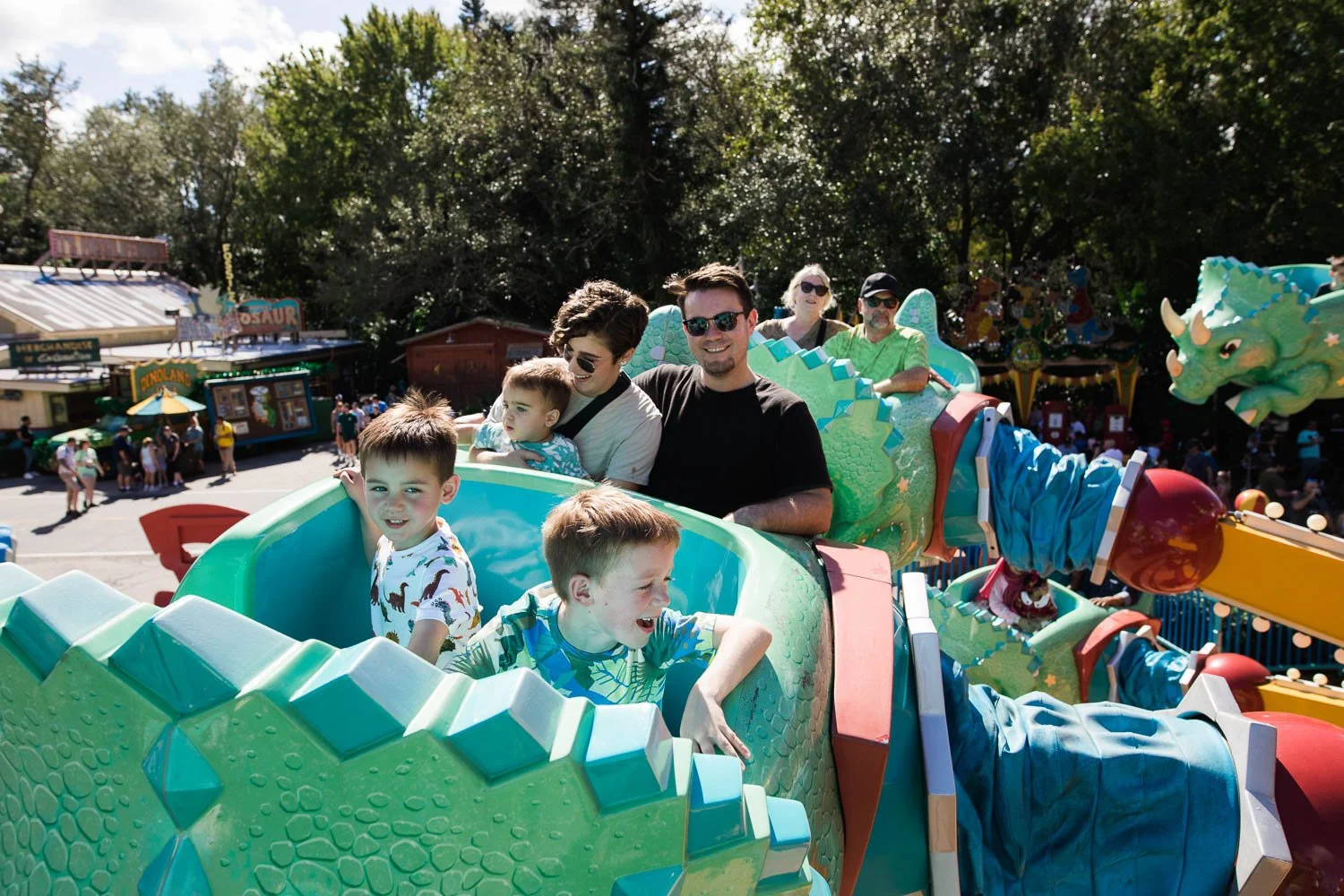 Family rides triceratops spin at the Animal Kingdom.