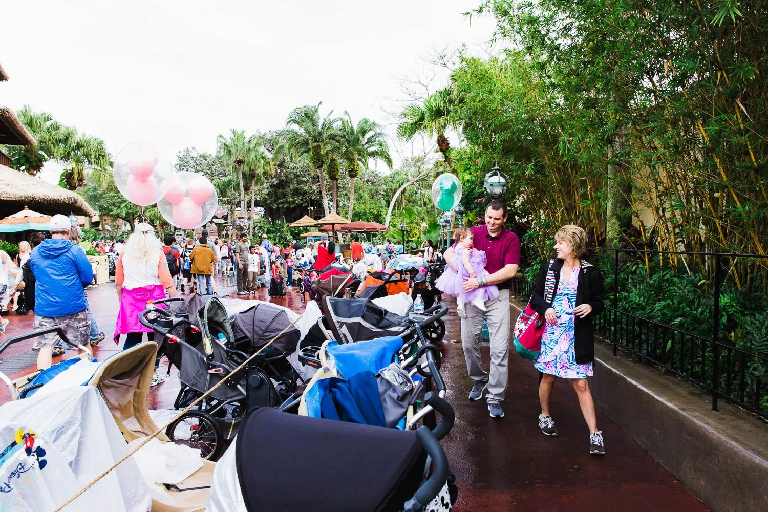 Family parks stroller in Adventureland at the Magic Kingdom.