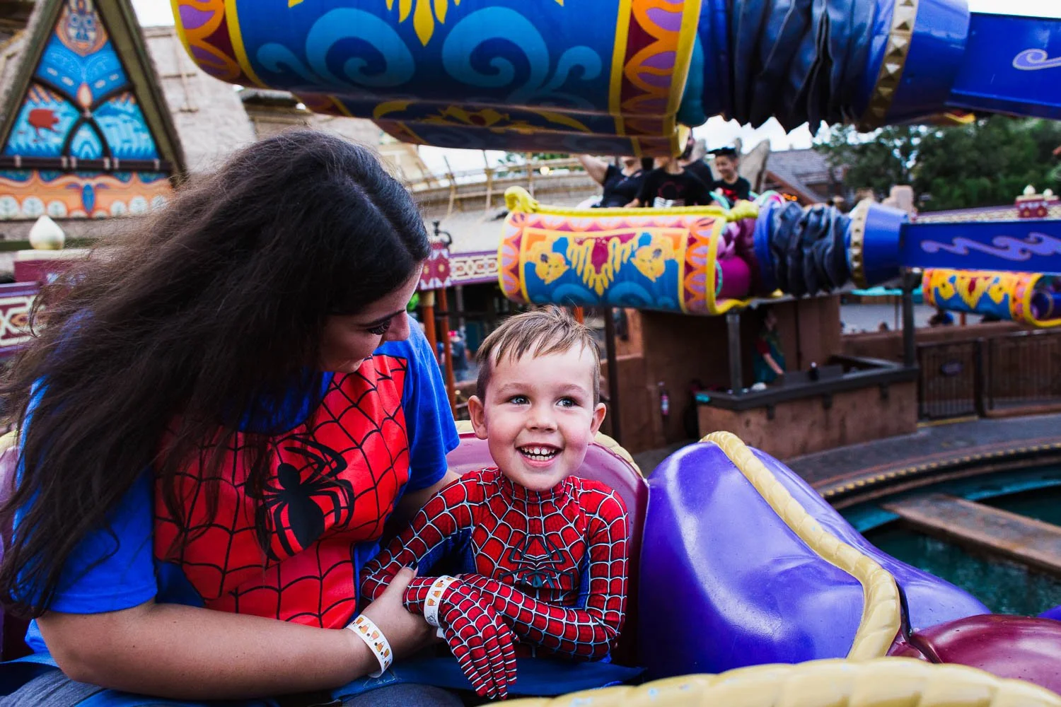 Mother and son ride the Magic Carpets of Aladdin in Magic Kingdom.
