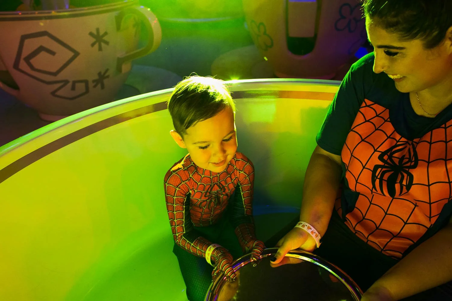 Mom and her son spin in the teacups at the Magic Kingdom during MNSSHP.