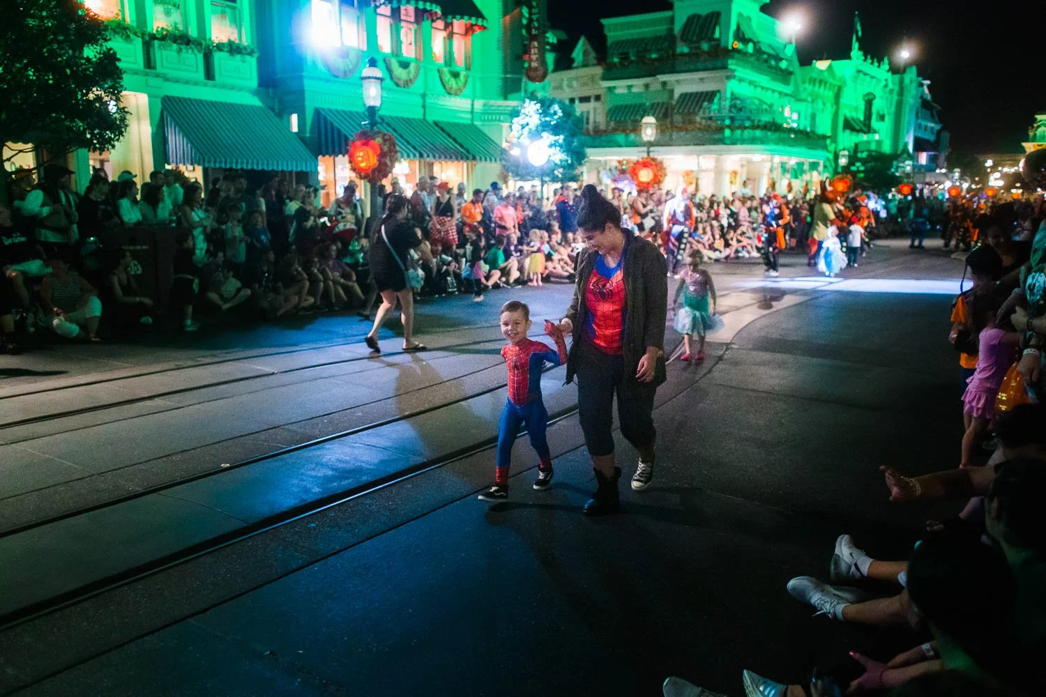 Mother and son, both dressed like Spider-Man walk down Main Street USA during MNSSHP.