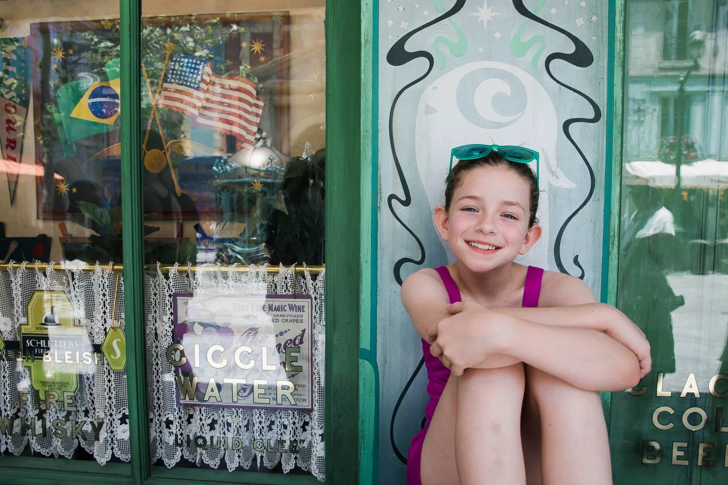 Girl waits patiently for her frozen butterbeer in Wizarding World.