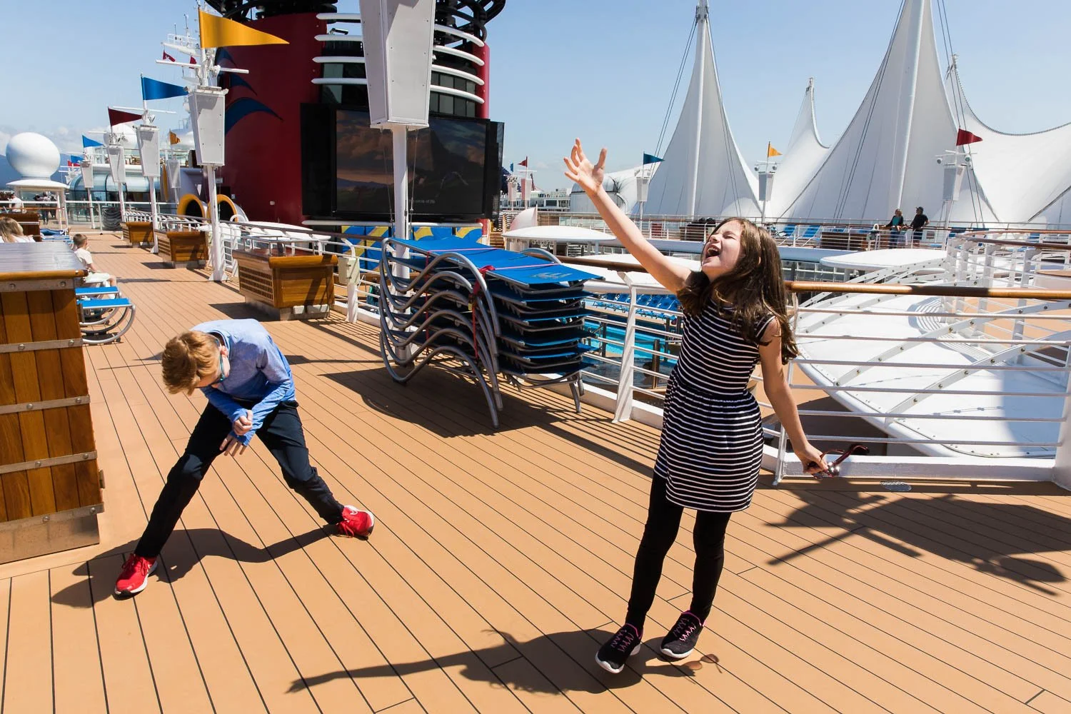 Kids singing in celebration to be on the Disney Wonder in Vancouver.