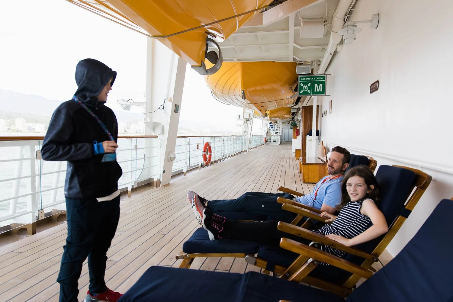 Family relaxes on board the Disney Wonder cruise ship.