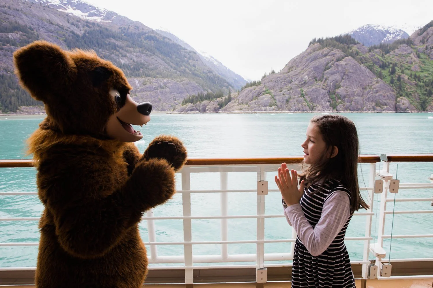 Little girl meets Koda on the Disney Wonder in Alaska.