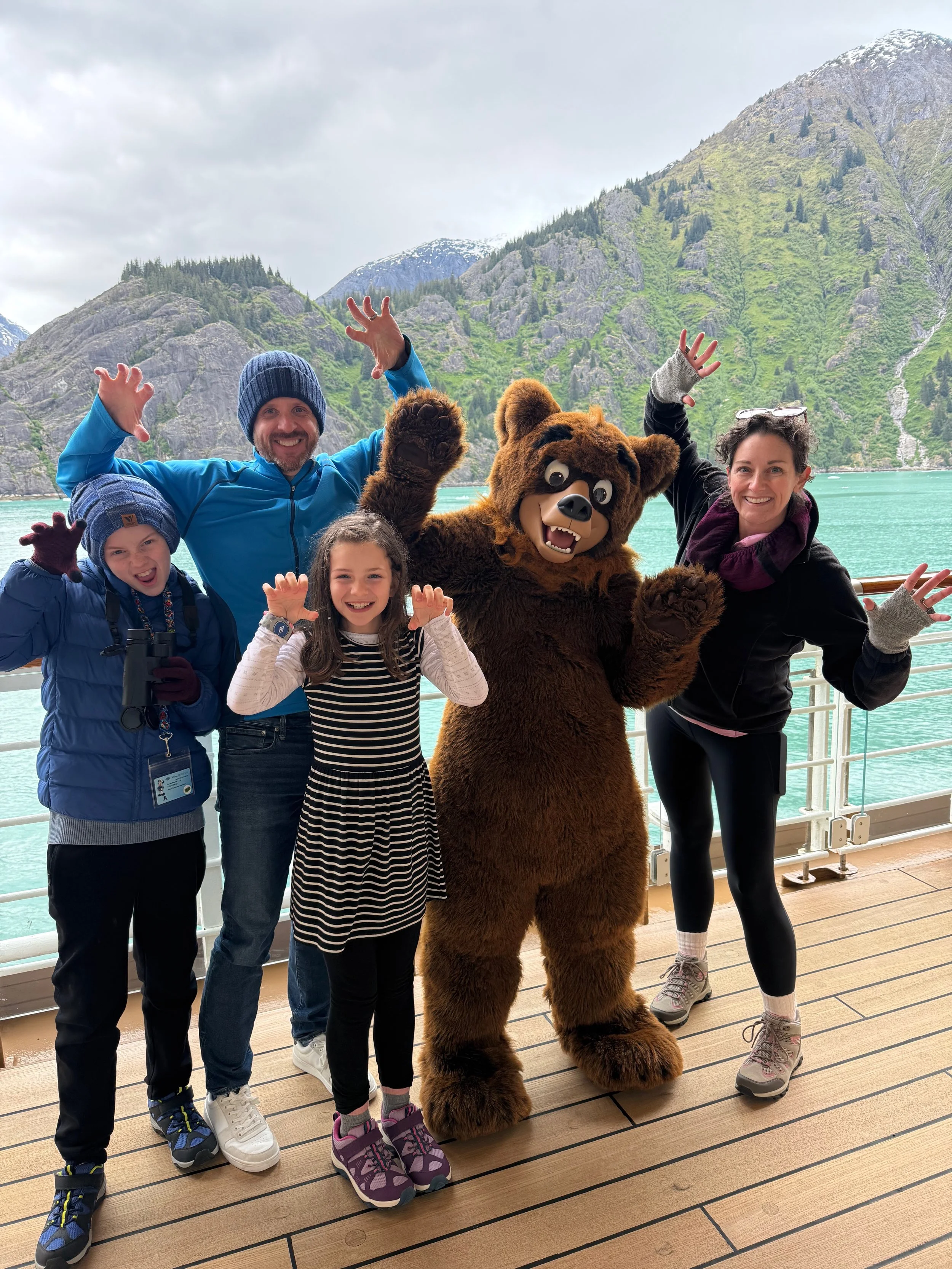 Family meets Koda from Brother Bear on the Disney Wonder in Alaska.