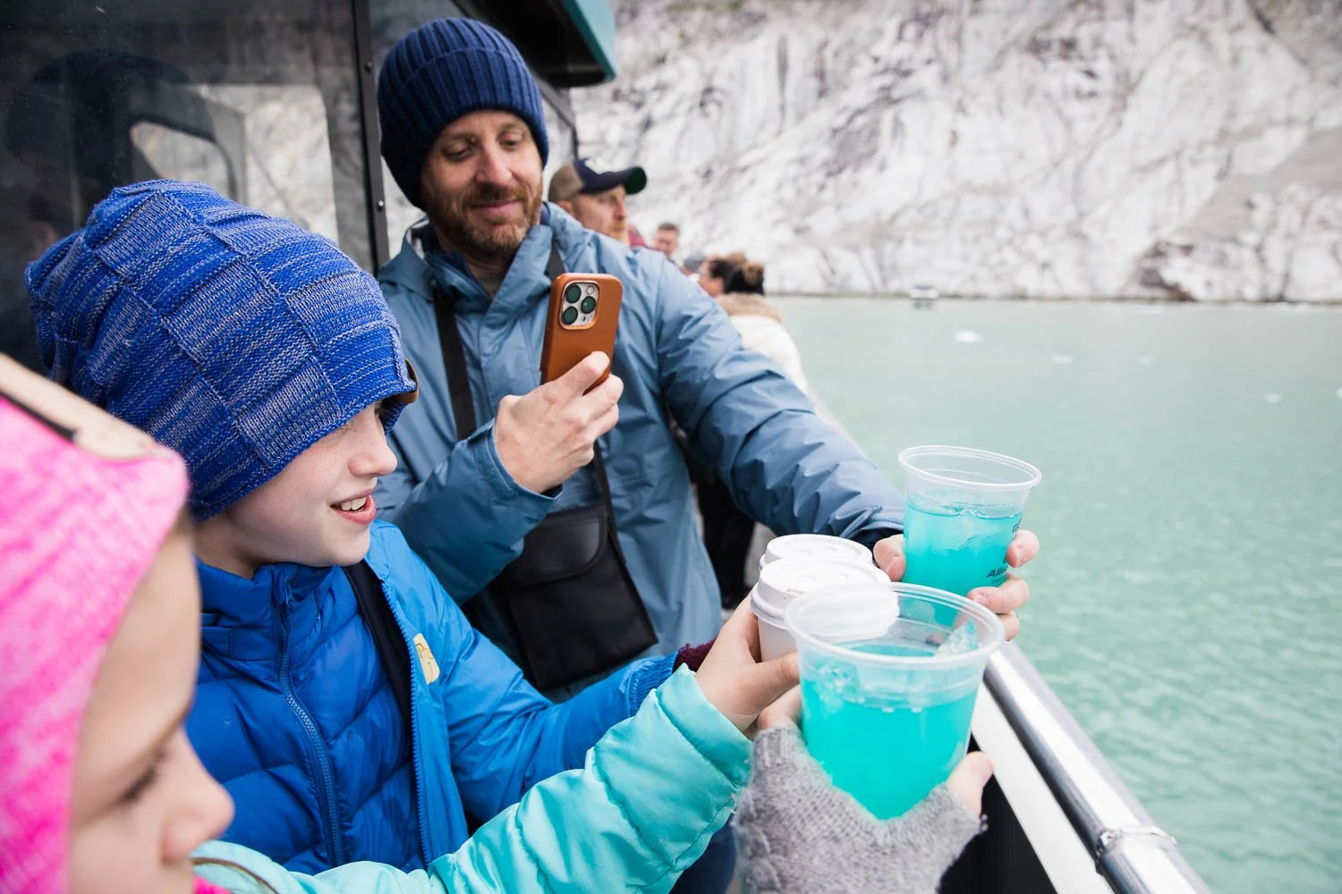 Tourists enjoy glacier-ritas on an Alaska boat excursion.