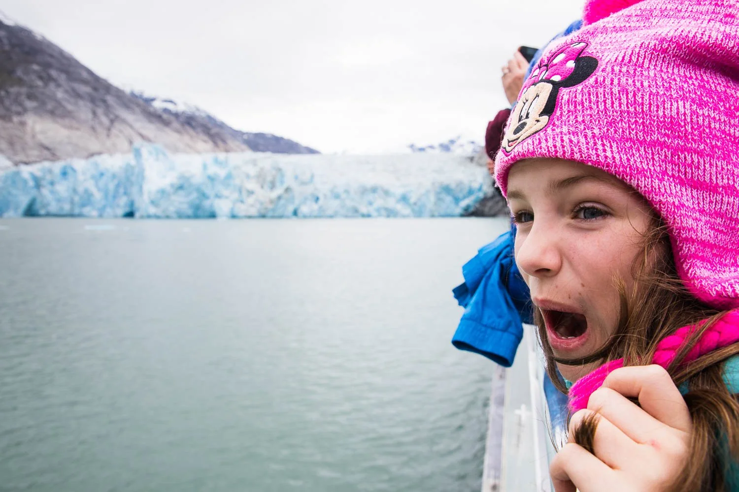 Girl reacts to a glacier calving in Alaska.