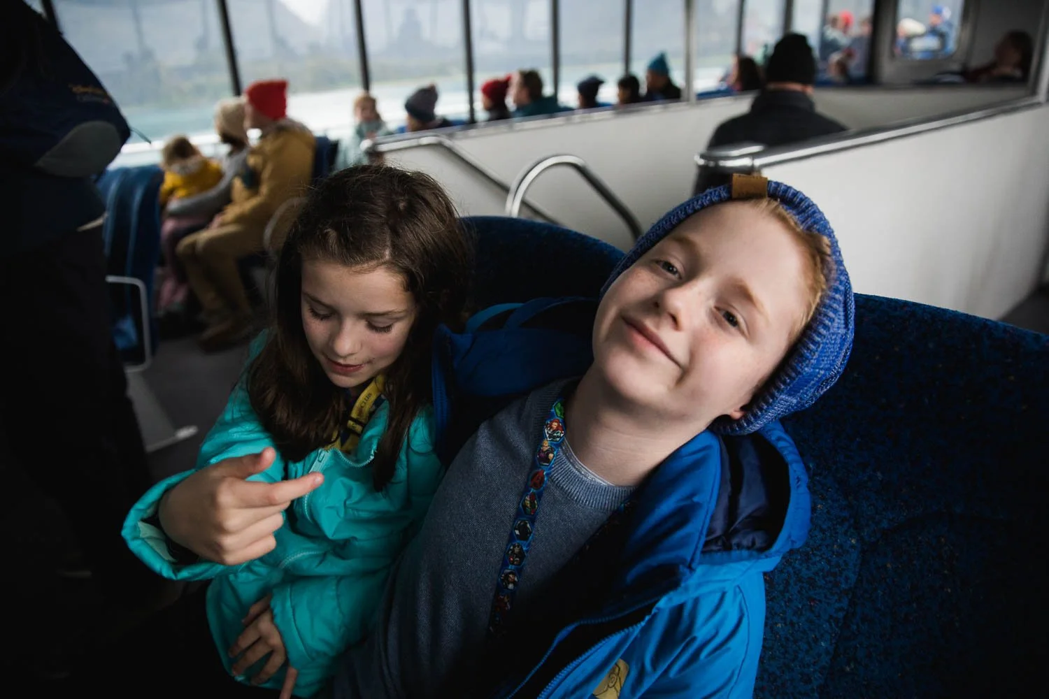 Siblings are punch drunk on a boat in Alaska.