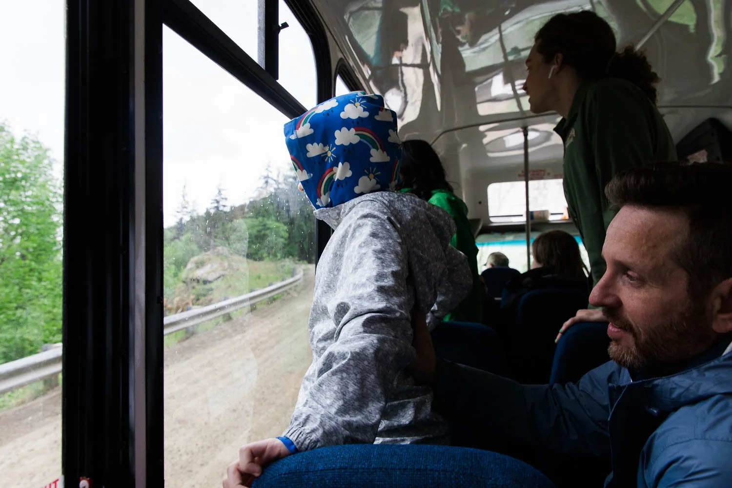 Tourists and tour guides look for bears in Skagway, Alaska.