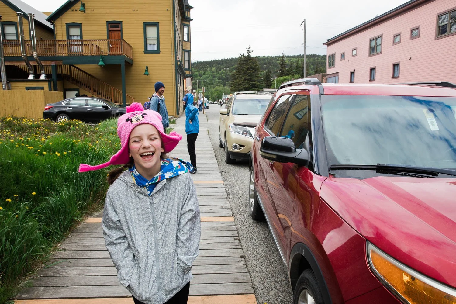 Kids laugh as they walk through the streets of Skagway, Alaska.