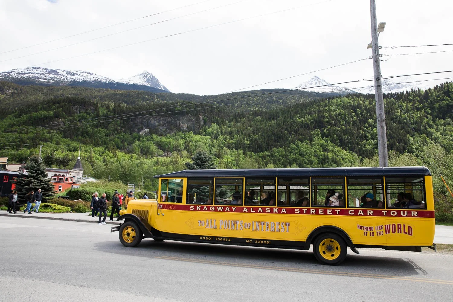 Old school tourbus drives through Skagway, Alaska.