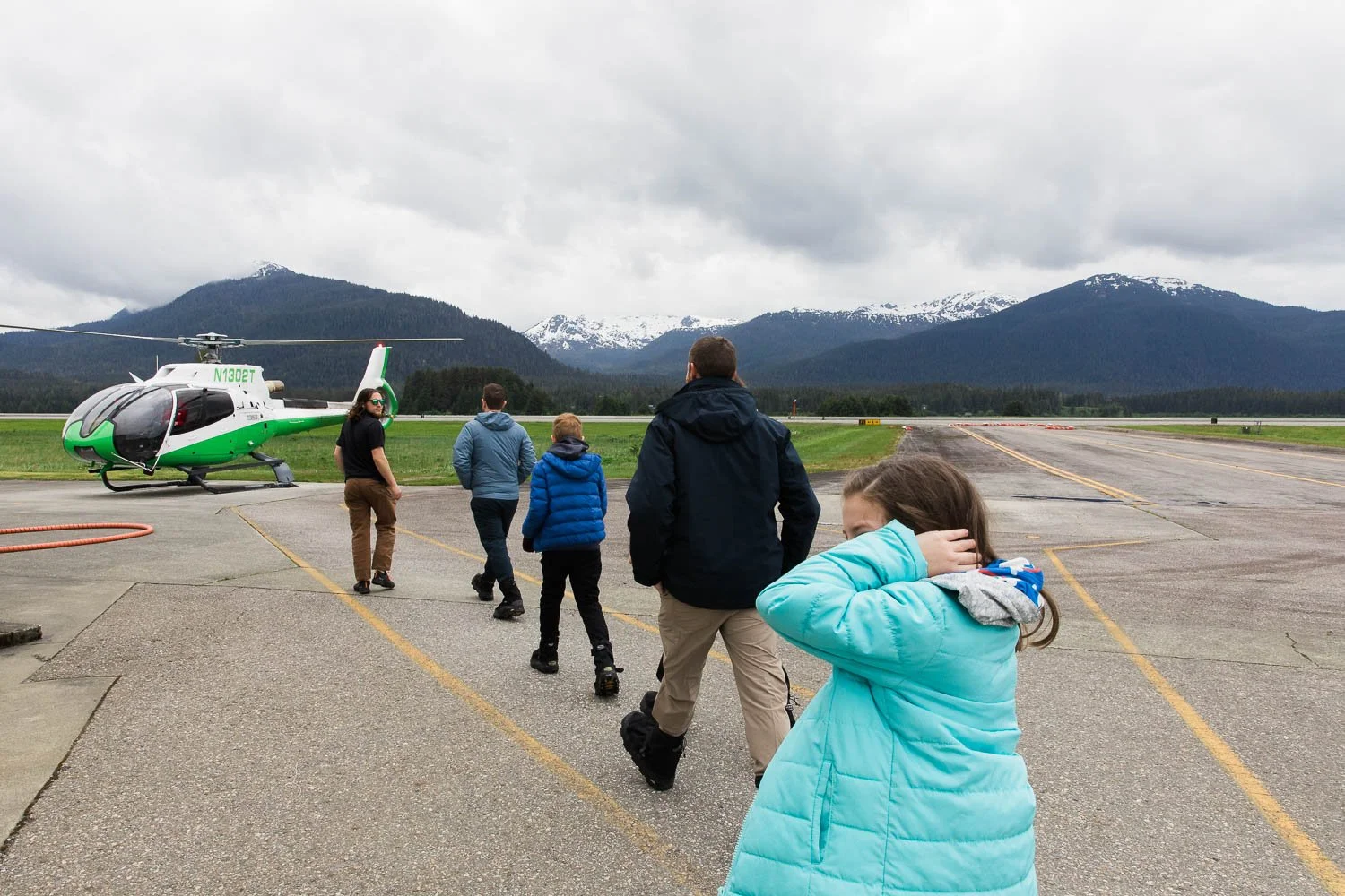 Family boards a Temsco helicopter for Mendenhall Glacier.