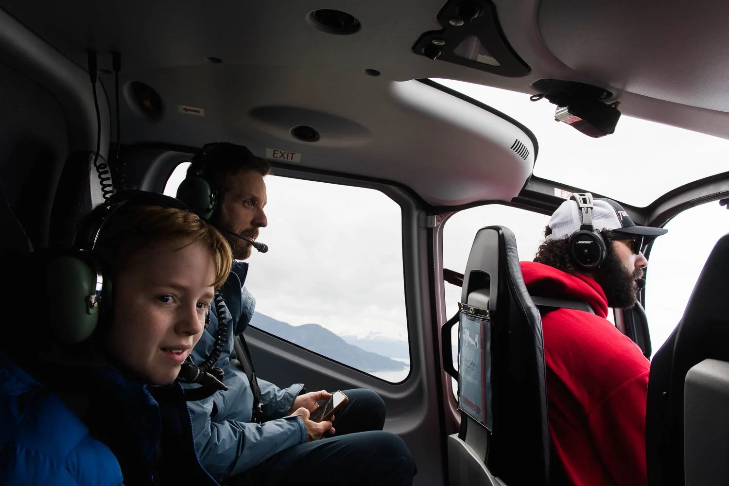 Family flies over Mendenhall Glacier in Juneau, Alaska.