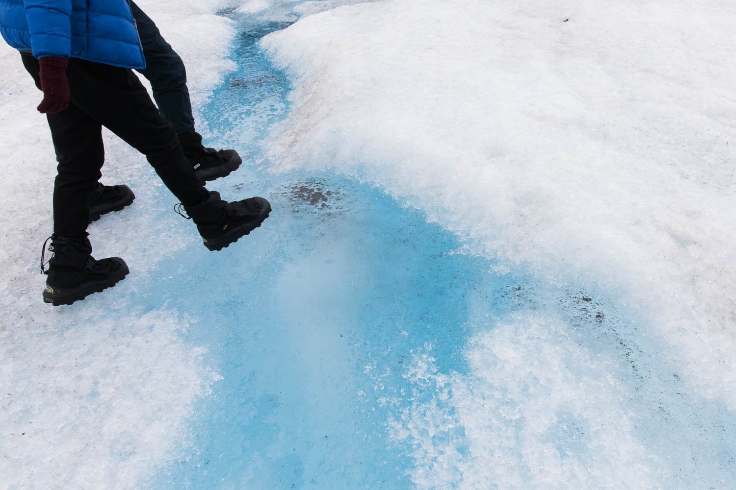 Glacier ice and boots with ice picks on them.
