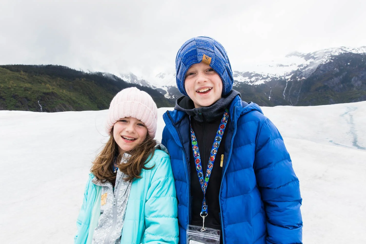 Siblings pose for a photo on top of Mendenhall Glacier.
