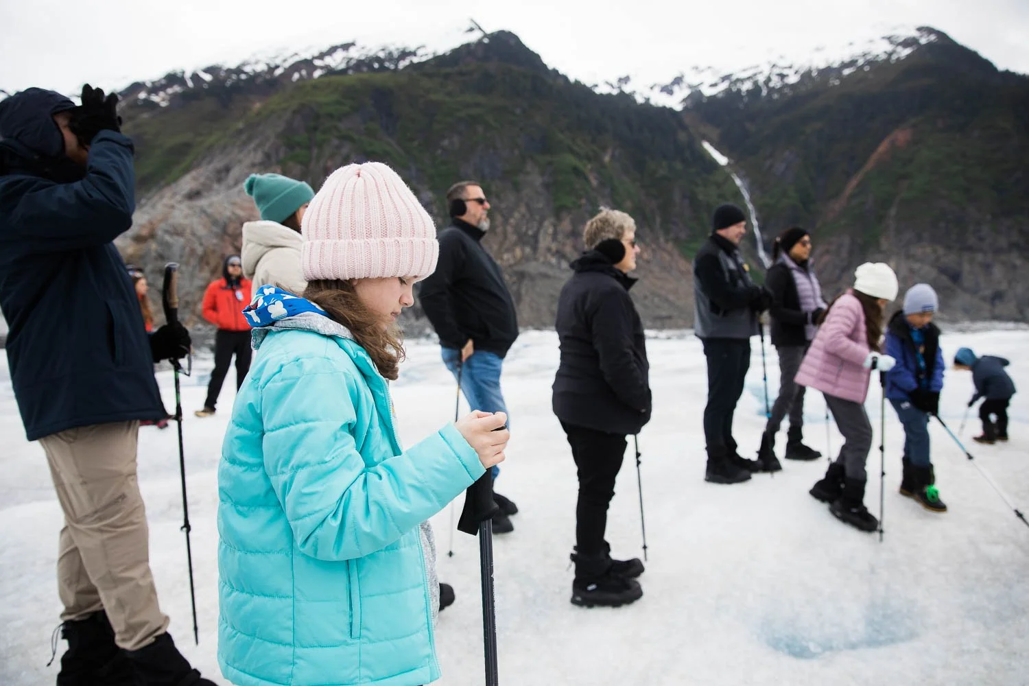 Group listens to a tour guide on Mendenhall Glacier.