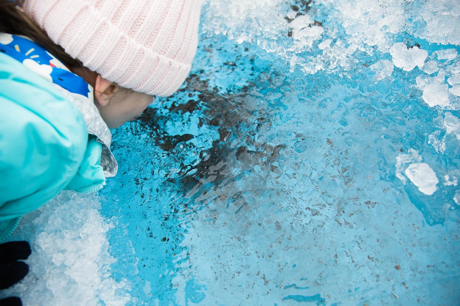 up close photo of glacier ice and water.