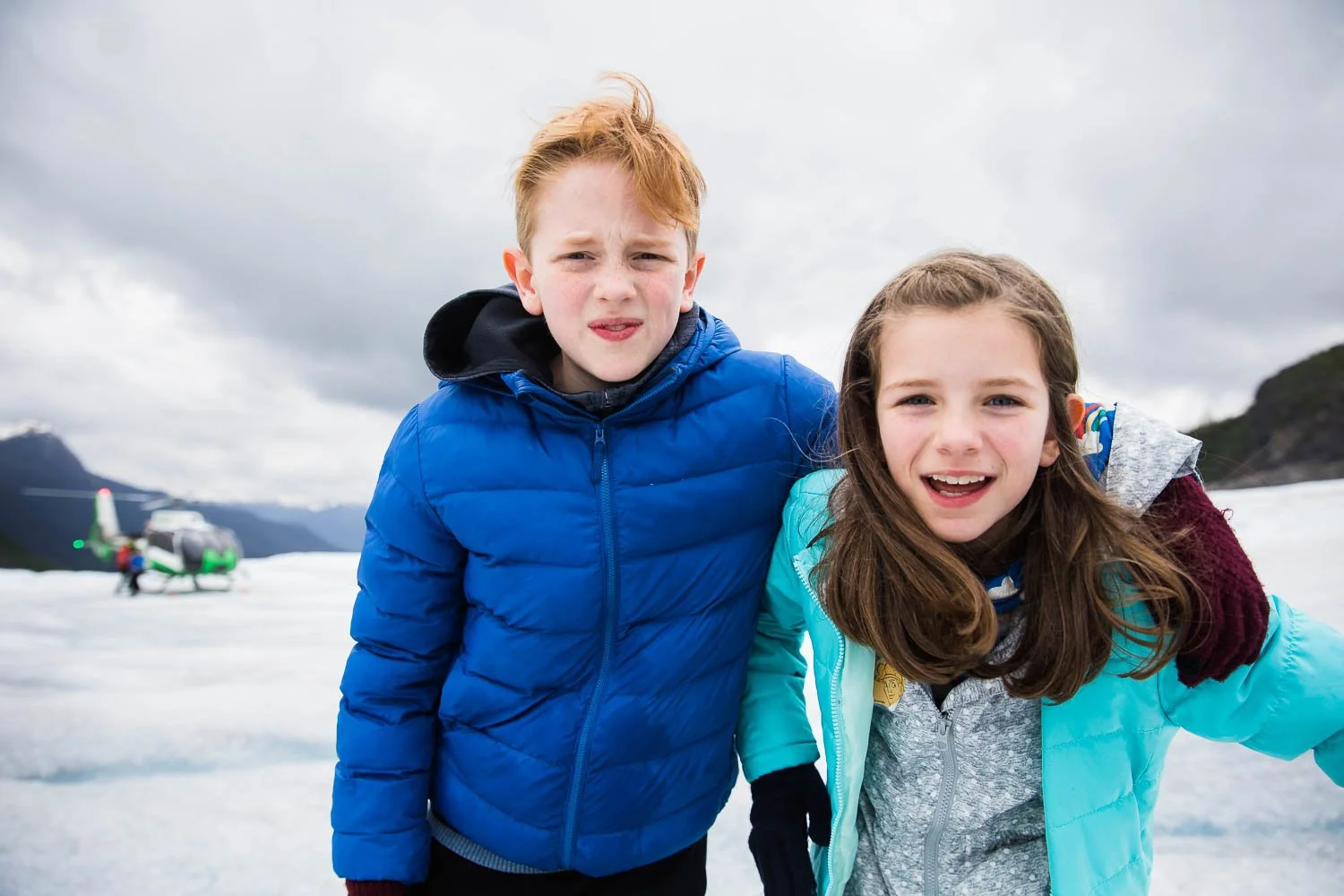 Siblings pose on top of Mendenhall Glacier.