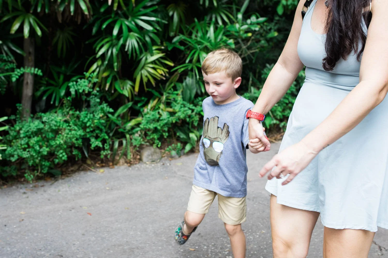 Mother and son walk through Animal Kingdom.