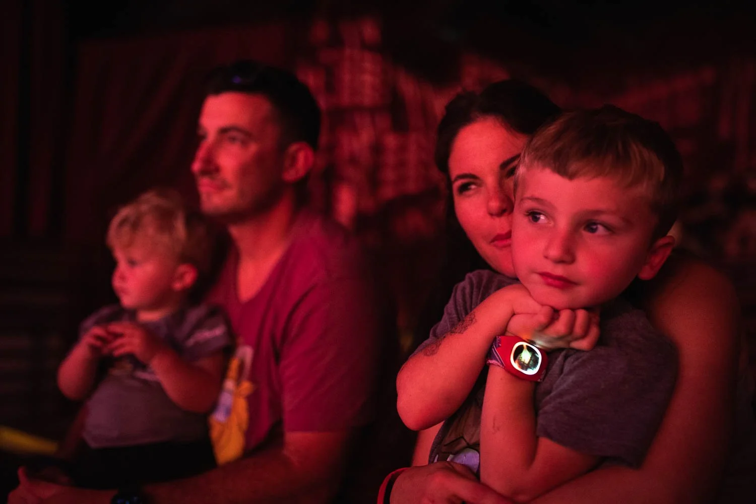Family watches the Festival of the Lion King at the Animal Kingdom.