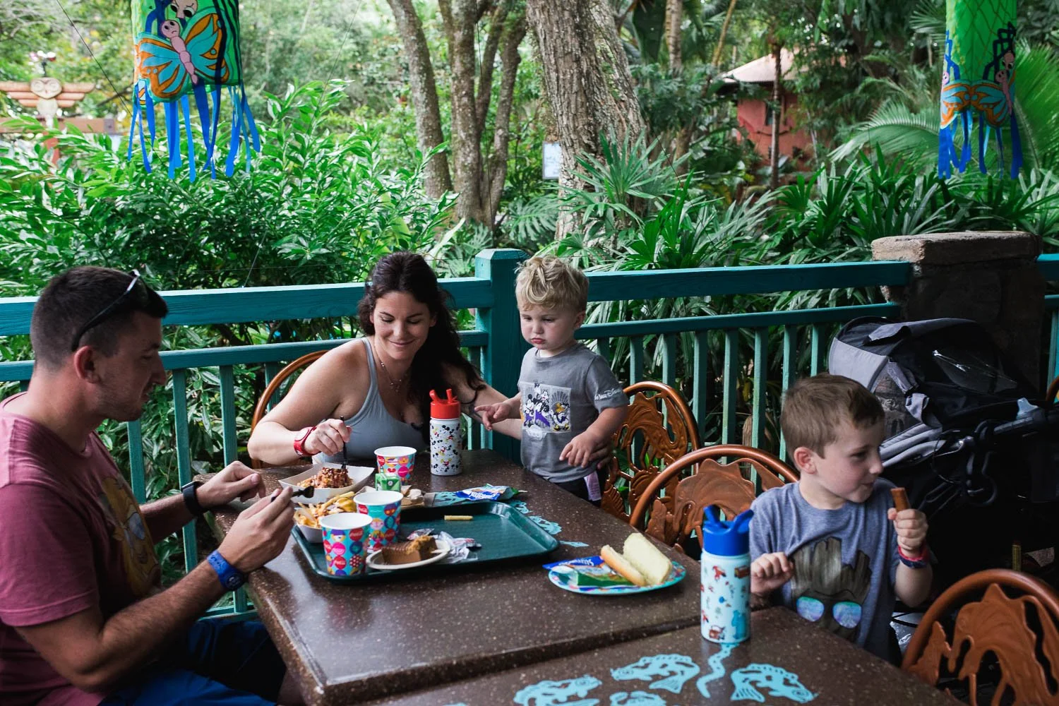 Family eats a meal at Flame Tree BBQ in the Animal Kingdom.