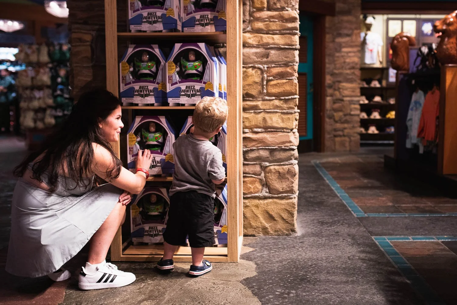 Kid picks out toys at the Island Mercantile in the Animal Kingdom.