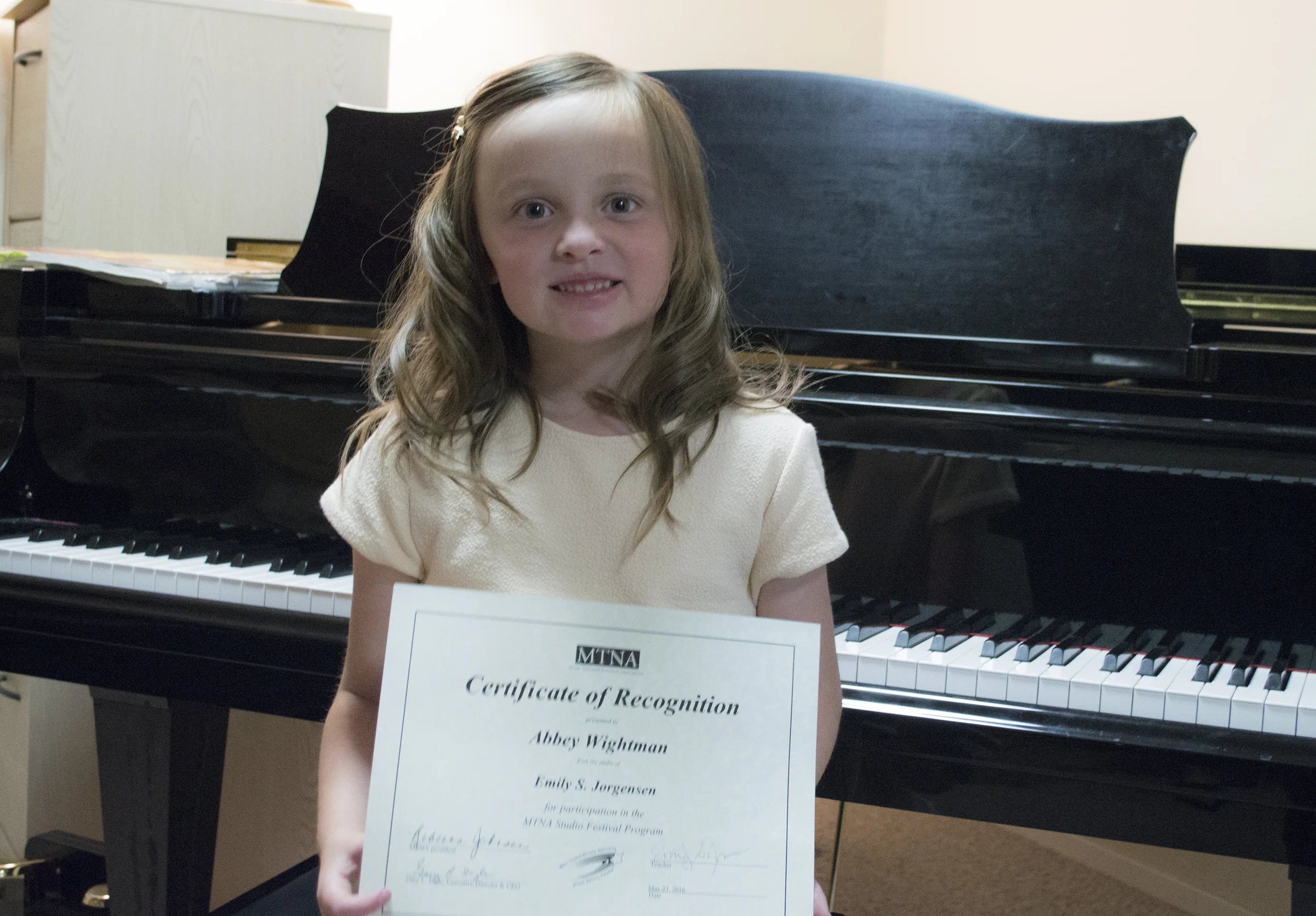 Abbey with her certificate. 