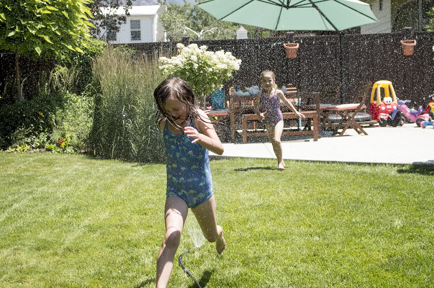Abbey and Maliya spent the afternoon running in the sprinklers. 